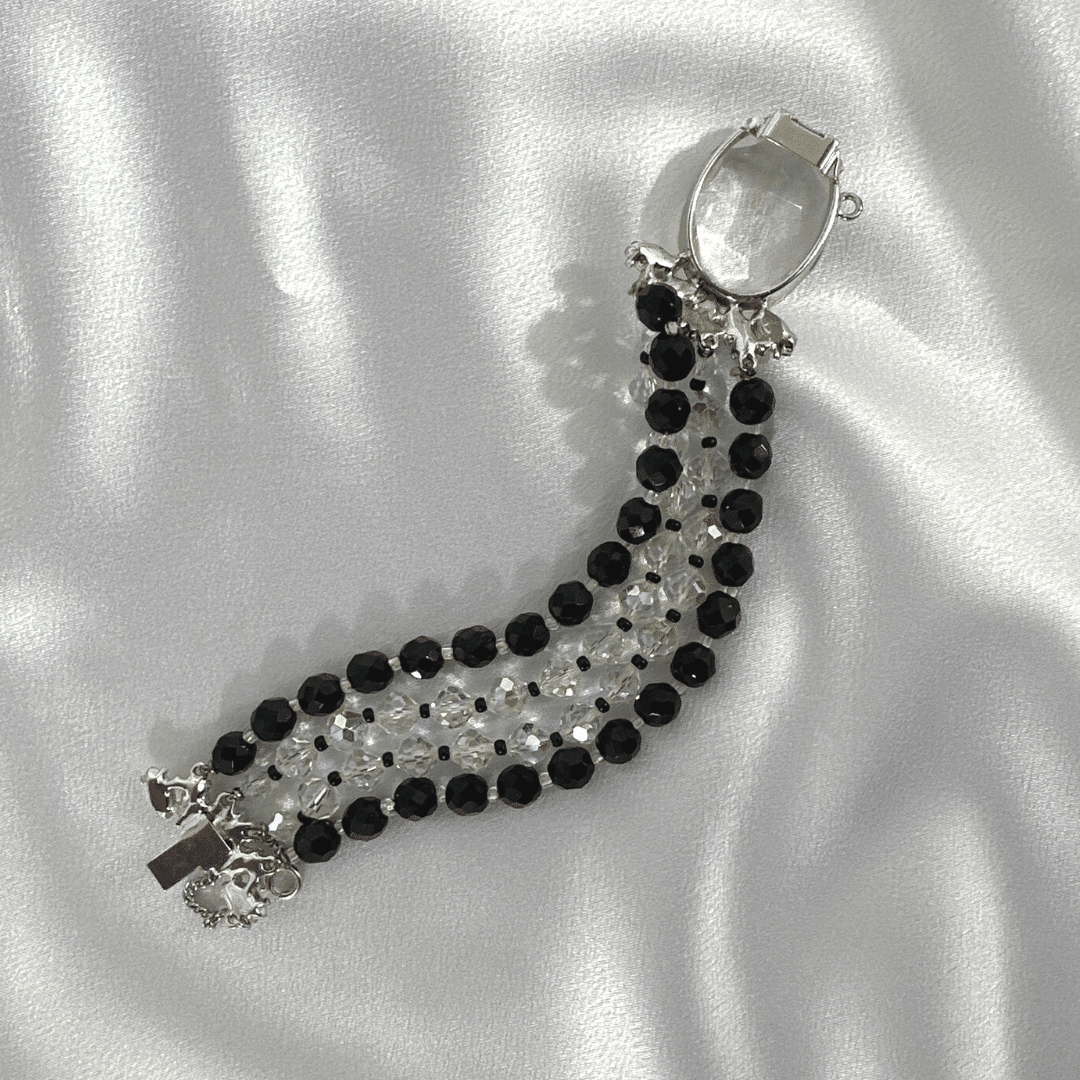 Black and Clear Lucite Bracelet with Accent Stone - on satin background - rear view