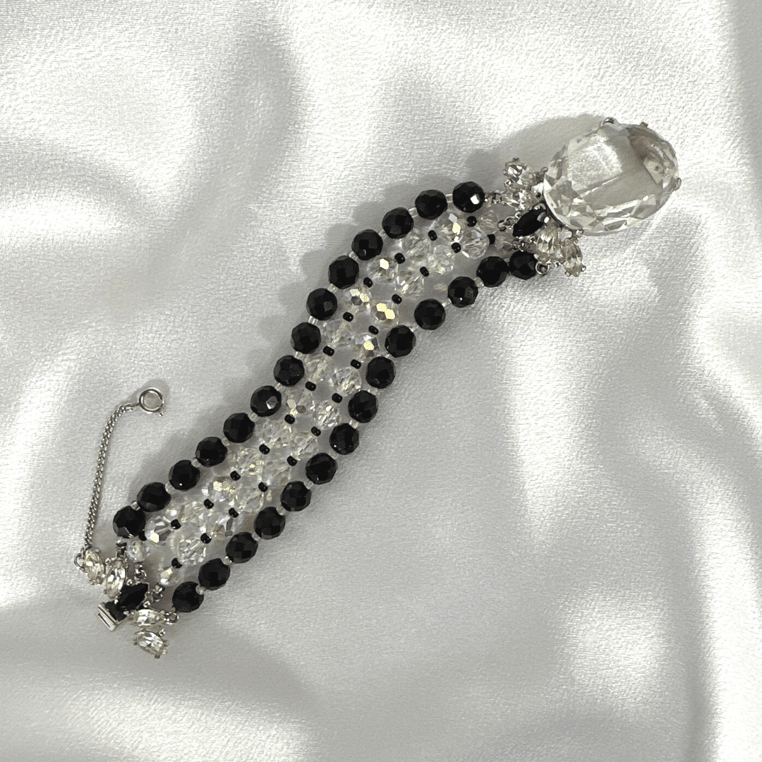 Black and Clear Lucite Bracelet with Accent Stone - satin background