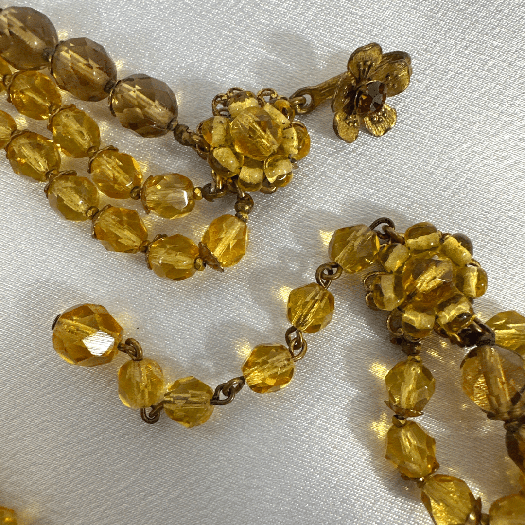 Demario Champagne Lucite Necklace - clasp detail - on satin background