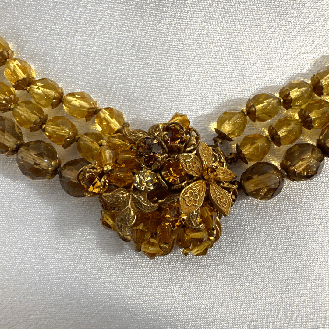 Demario Champagne Lucite Necklace - stone detail - on satin background