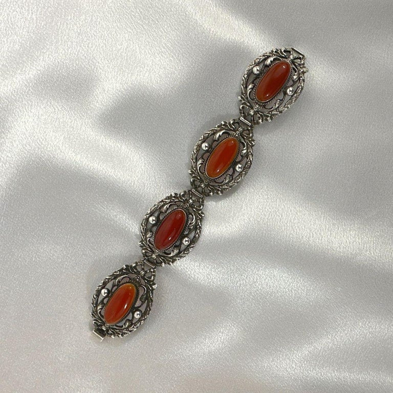 Vintage Silver and oval cabochon Canelion Bracelet, link detail, satin background