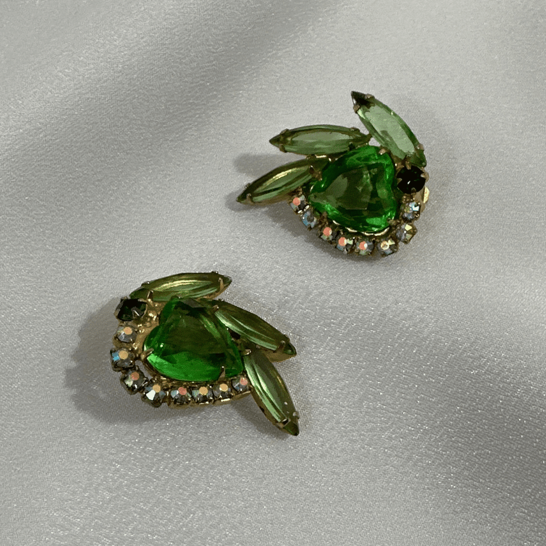 Vintage Unsigned Julianna Green Heart Cut Glass and Rhinestone Earrings - satin background
