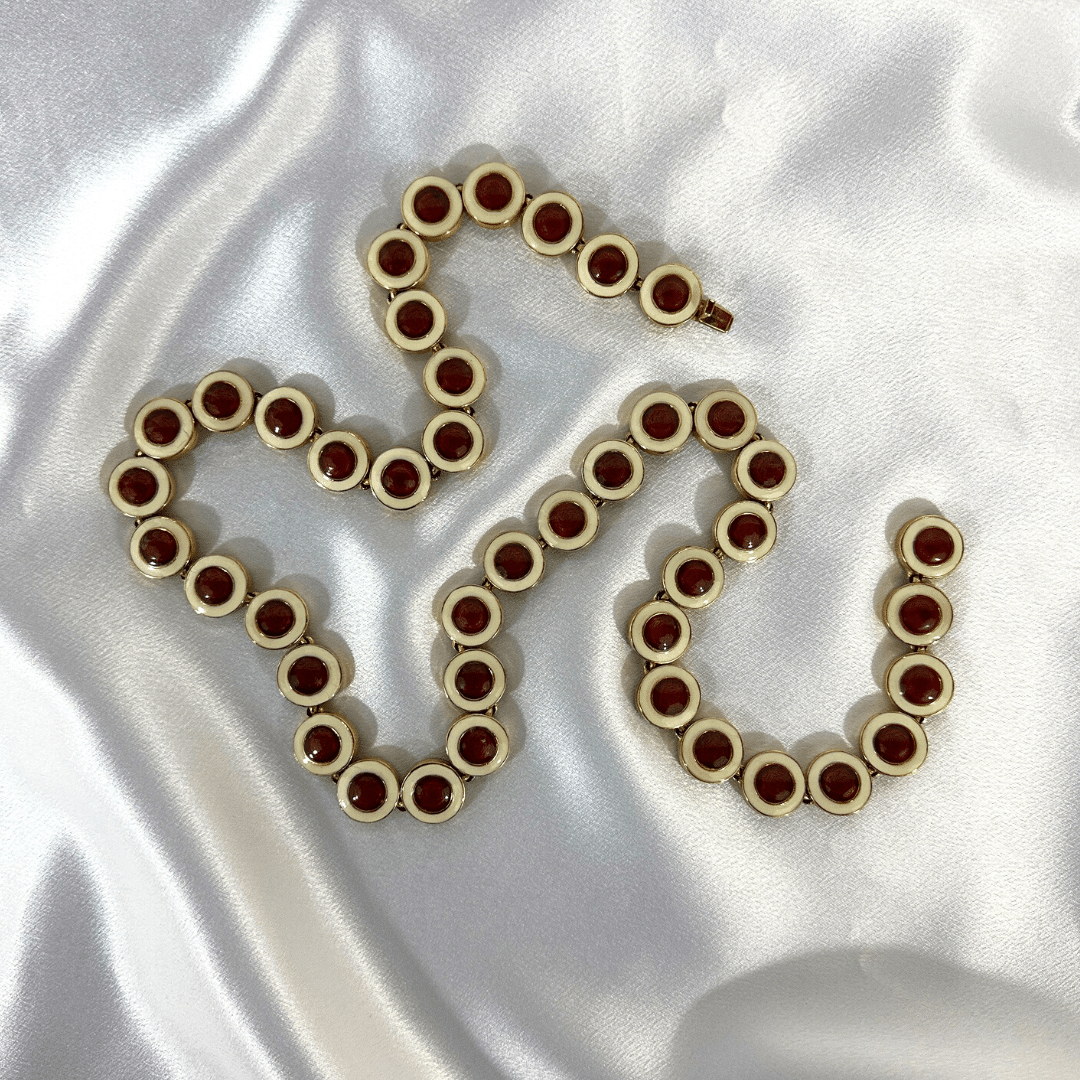 CINER Enamel Link Necklace on Satin Background, full length