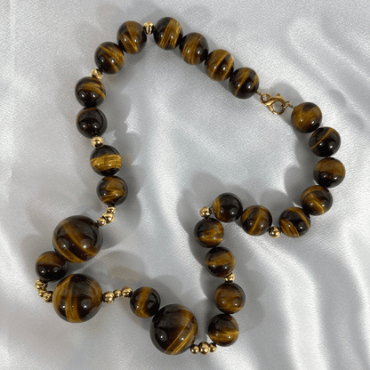 CINER Tigers Eye Necklace on Satin background