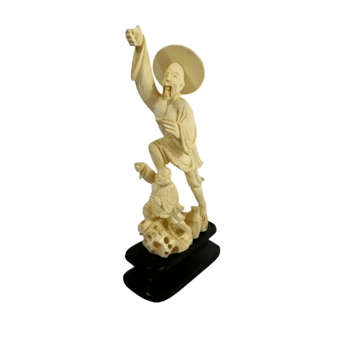 Vintage Chinese carved ivory statue depicting two men in traditional dress, finely detailed with a wide-brimmed hat and flowing robes.