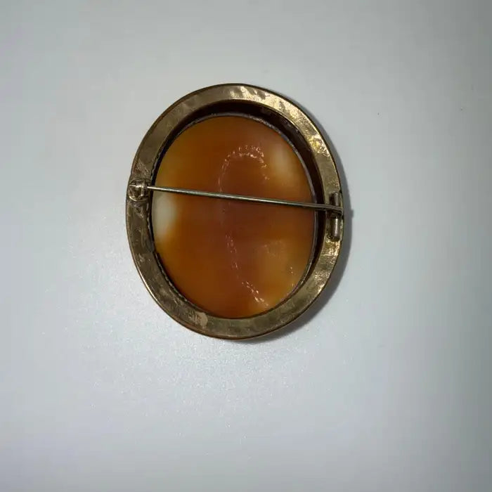 Victorian Shell Cameo Brooch Featuring Seated Flutist, Tree, and Bridge in Pastoral Scene, Late 19th Century