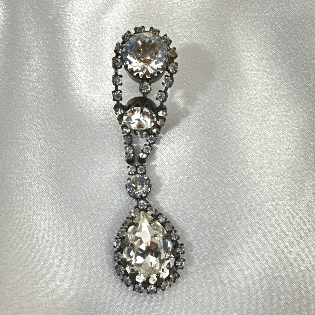 Ornate Japanned Great Cut Rhinestone Drop Earrings - single earring on satin