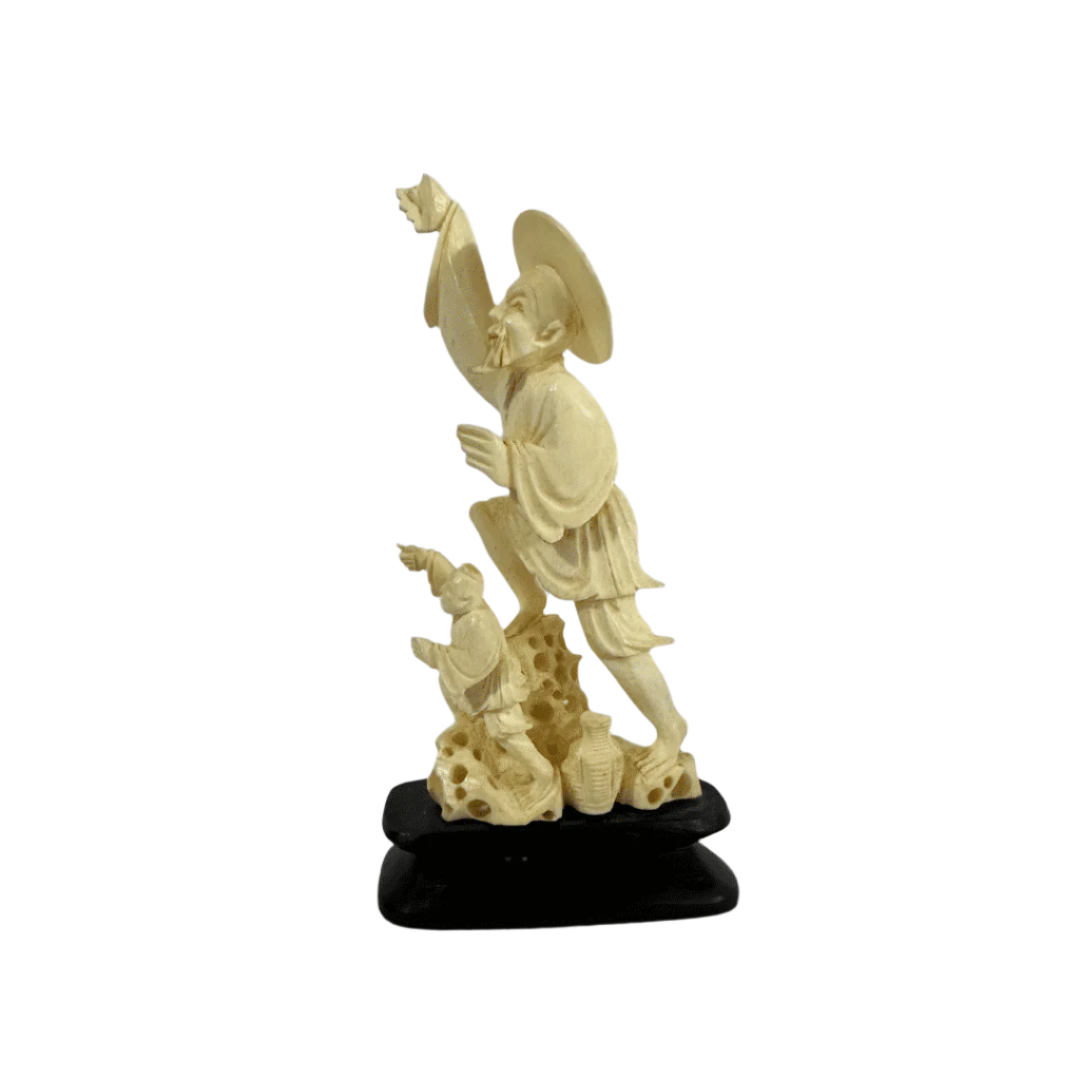 Vintage Chinese carved ivory statue depicting two men in traditional dress, finely detailed with a wide-brimmed hat and flowing robes.