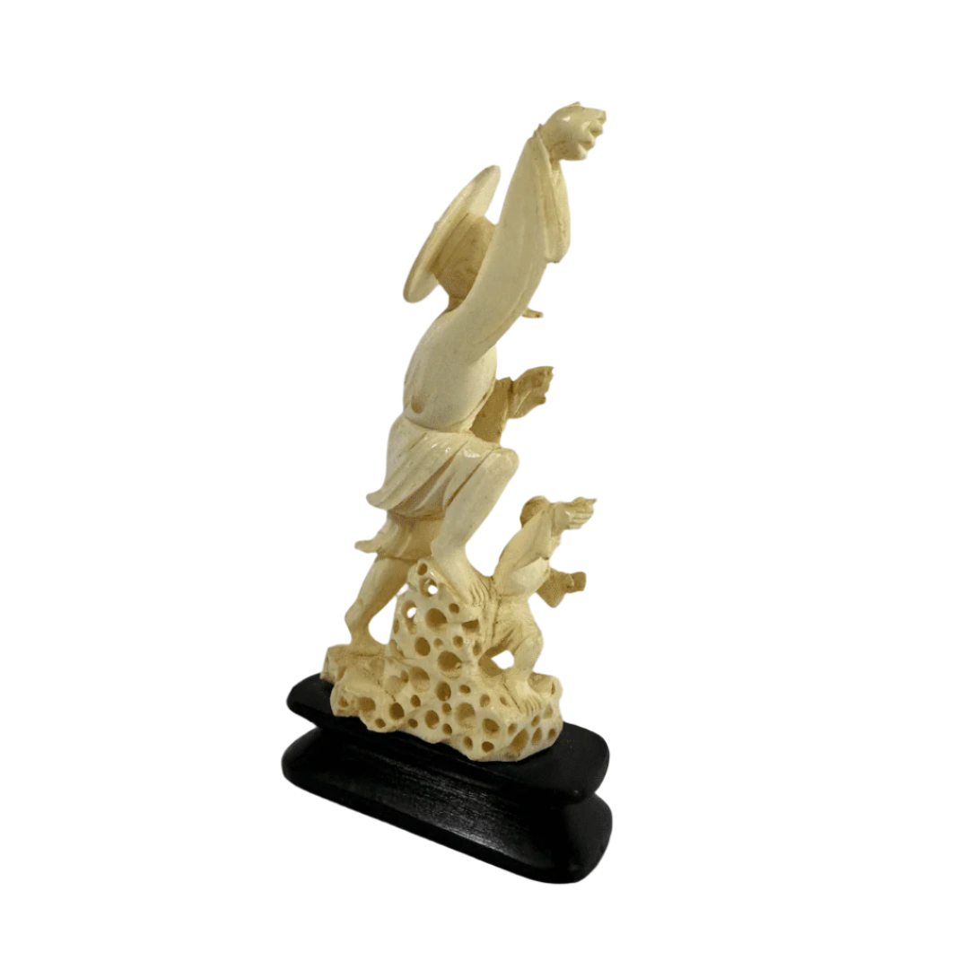 Vintage Chinese carved ivory statue depicting two men in traditional dress, finely detailed with a wide-brimmed hat and flowing robes.